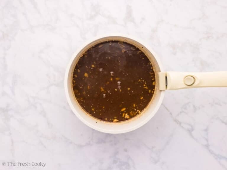 Sticky wing sauce in a sauce pan after cooking down.