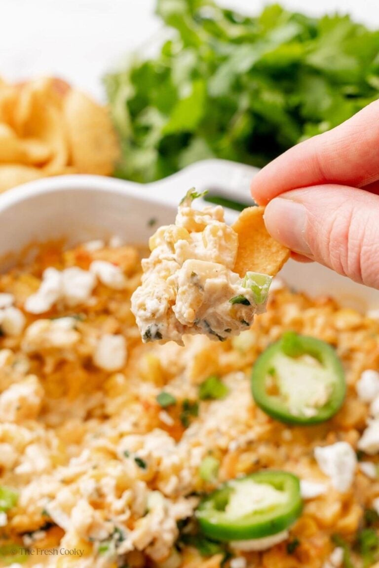 Frito scoop chip with Mexican corn dip on it.