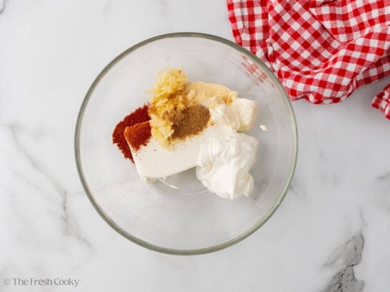 Cream cheese, sour cream, mayo, garlic and spices in a mixing bowl.