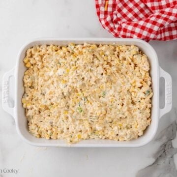 Mexican street corn dip placed into a baking dish.