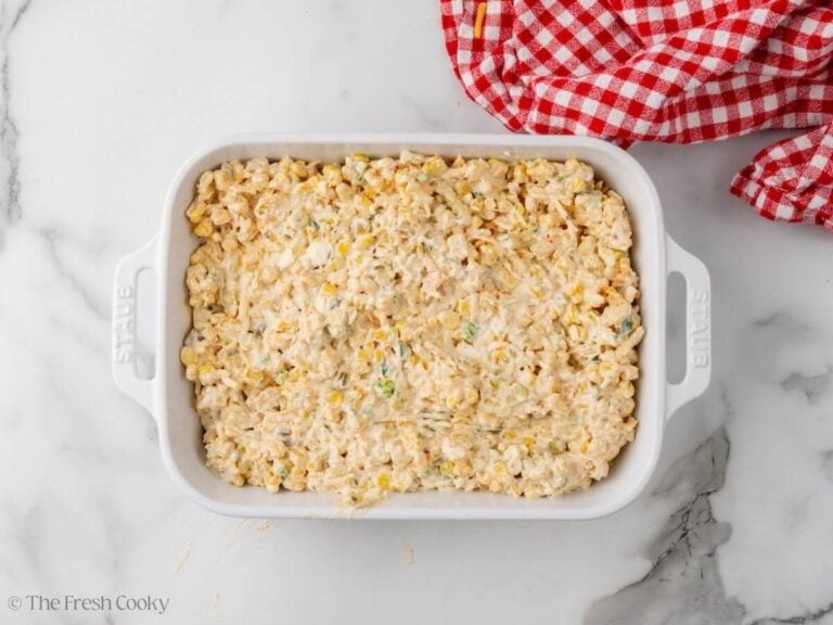 Mexican street corn dip placed into a baking dish.