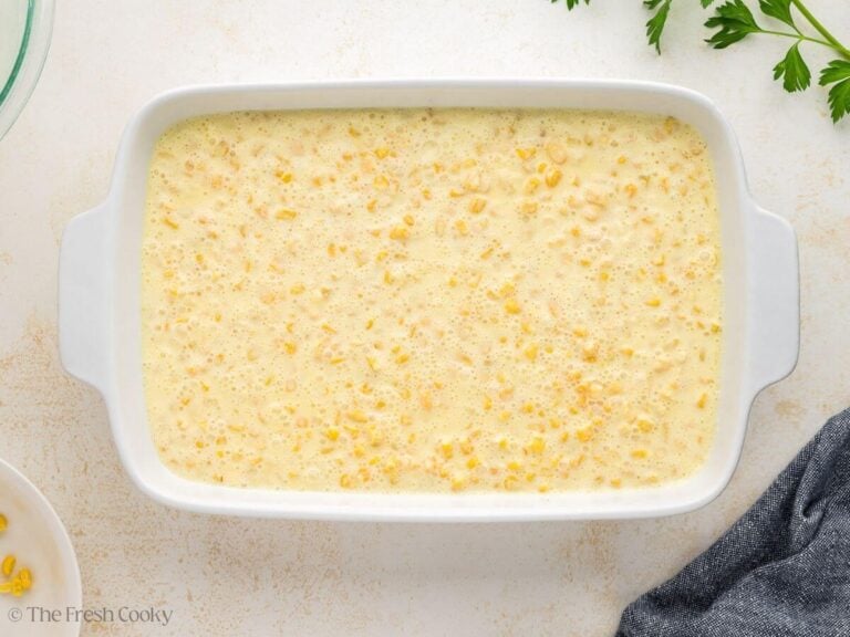 Corn pudding casserole batter poured into a baking dish.