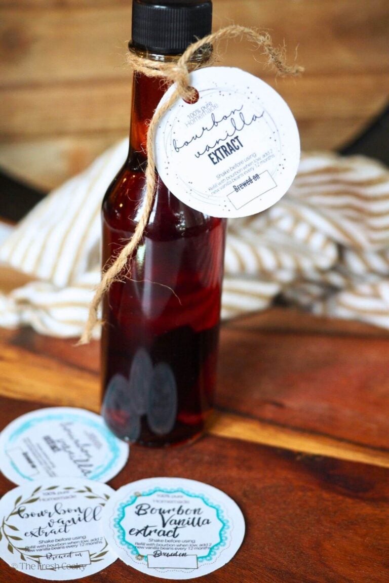 A bottle of amber liquid, containing bourbon vanilla extract with a several options for free printable labels.