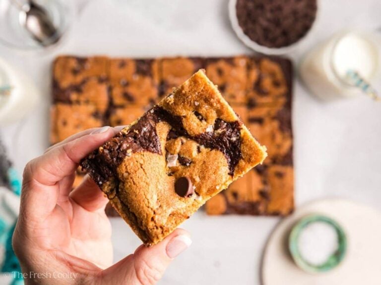 A hand holding a brookie bar.