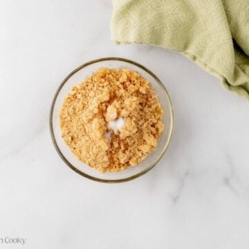 Graham crackers with butter and sugar in a small bowl.