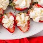 Close up of deviled strawberries topped with graham cracker sugar mixture.