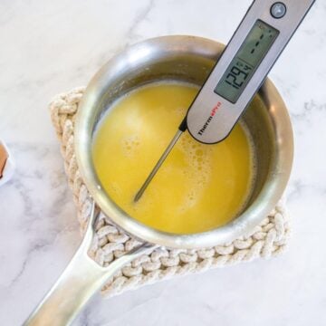 Thermometer in milk mixture for cinnamon rolls.