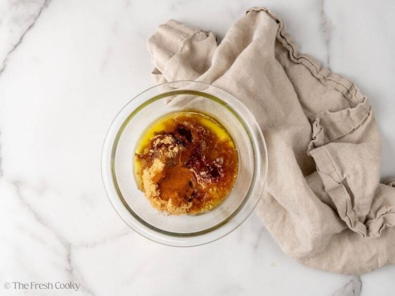Glaze for carrots in a small bowl before being whisked together.