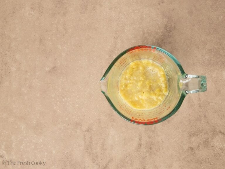 Mashed bananas in measuring cup.
