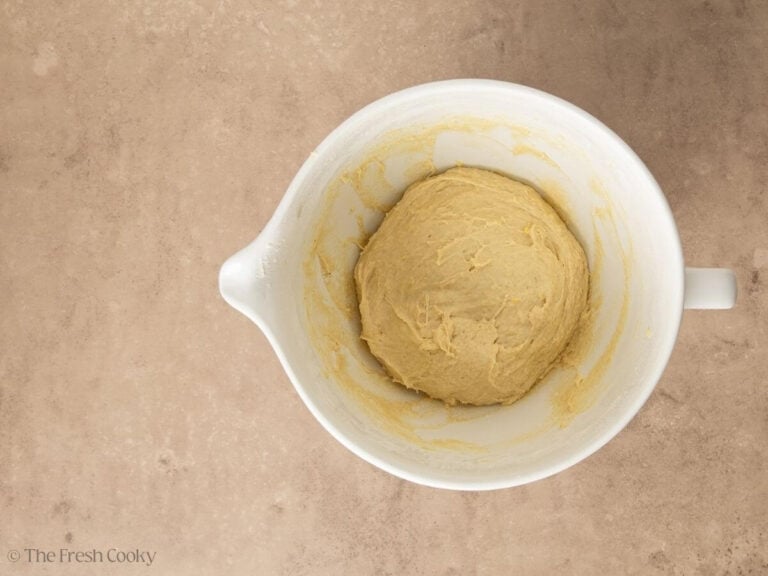 Cinnamon roll dough in a bowl ready to rise.