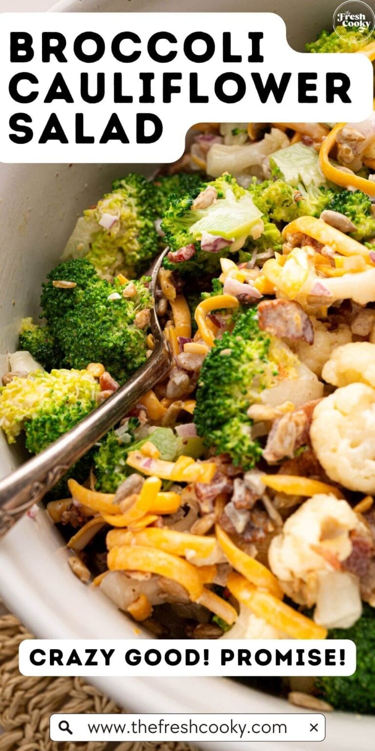 Spooning a serving of broccoli cauliflower salad with bacon, cheese and sunflower seeds, to pin.