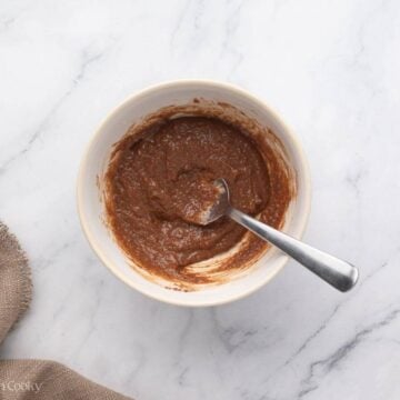 Cinnamon bun filling mixed together in a bowl.