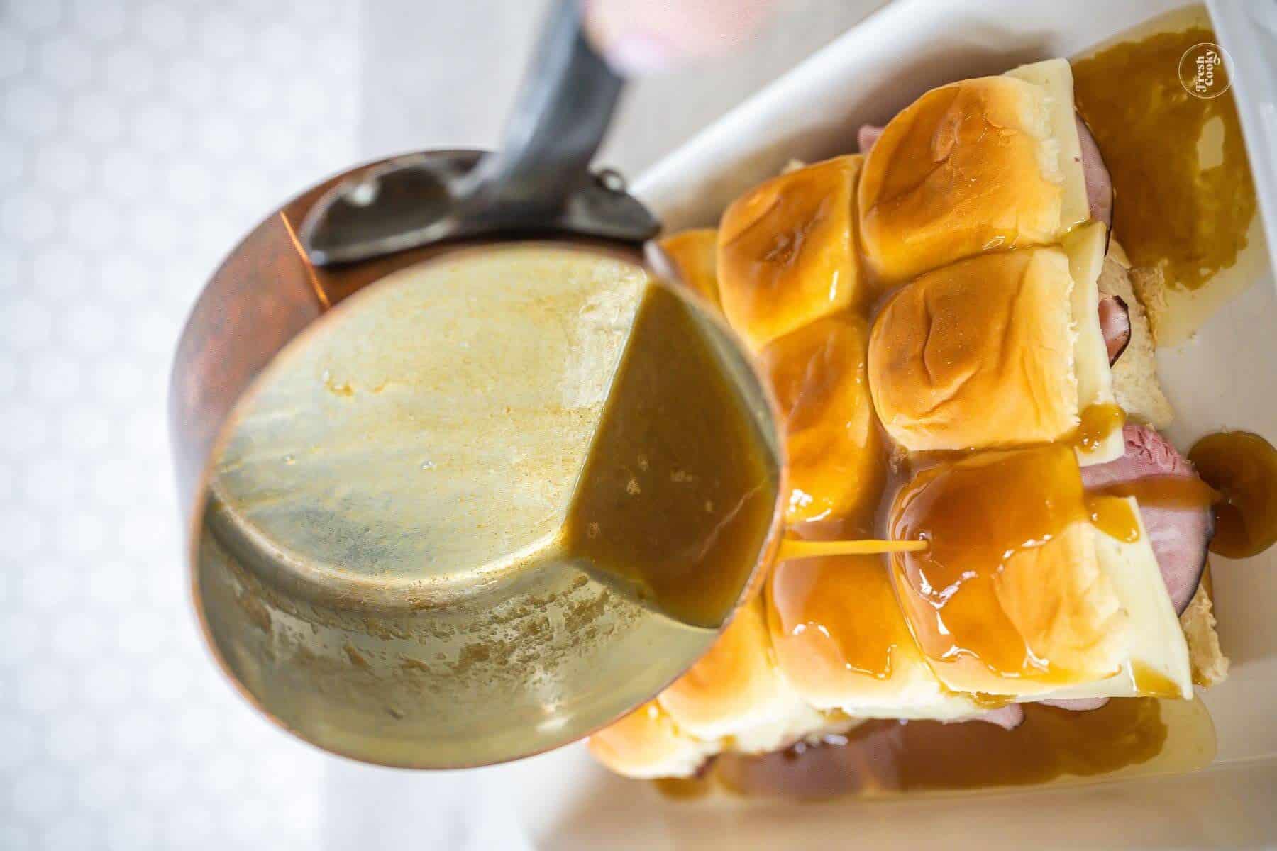 Pour sauce all over the tops and sides of the Hawaiian Rolls.