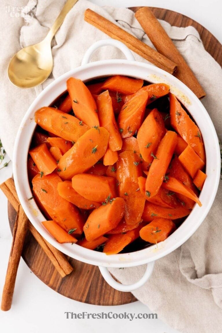 Looking down at a bowl of glazed carrots made in a slow cooker, for pinning.