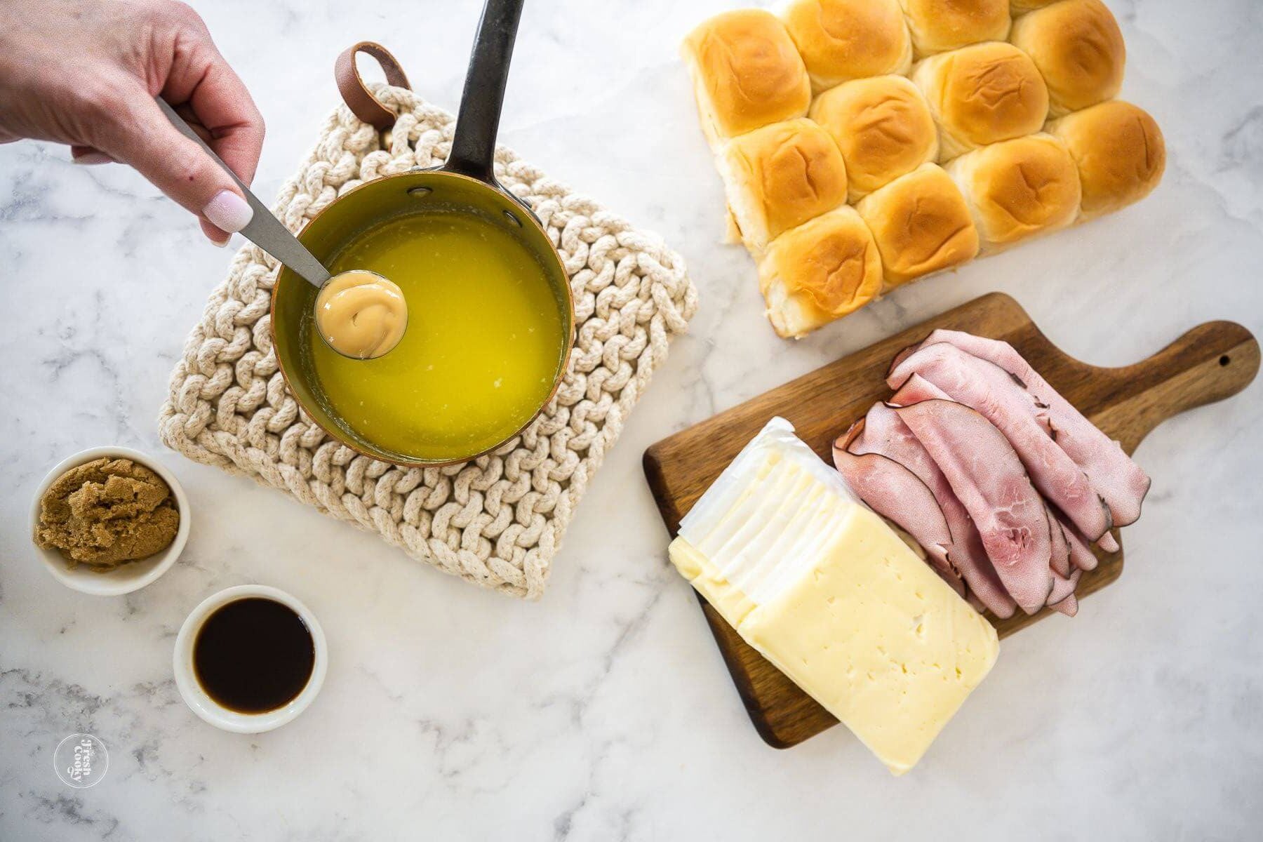 Add Dijon mustard, Worcestershire and brown sugar to melted butter.