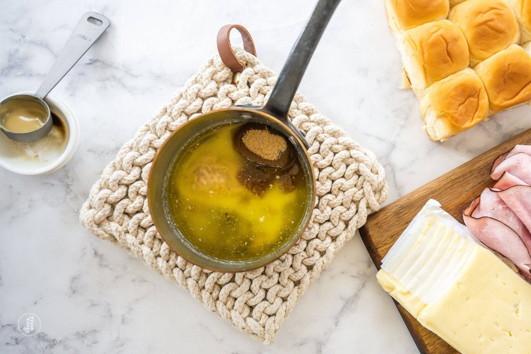 Butter Brown sugar sauce ready to mix in pan for Hammy Sammies.