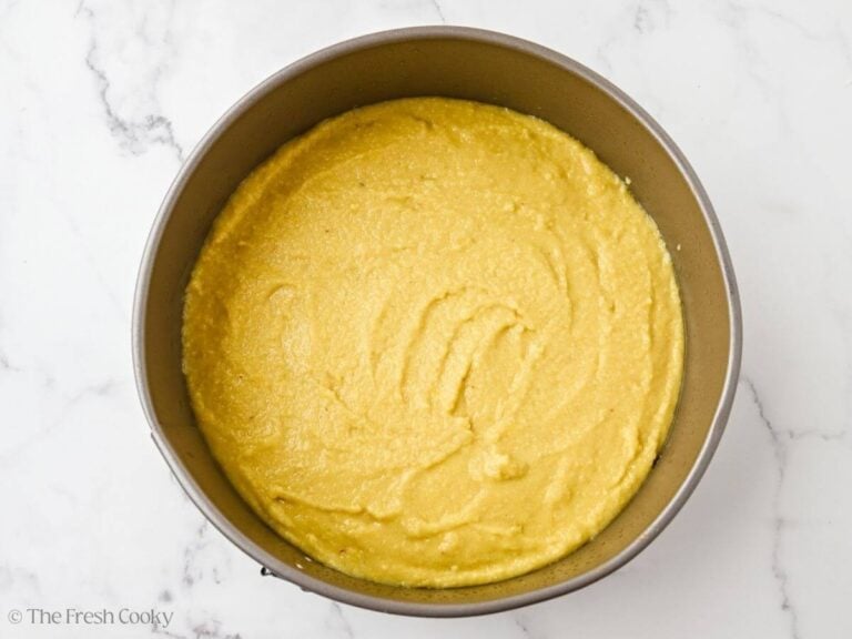A cake pan with almond flour olive oil cake batter.