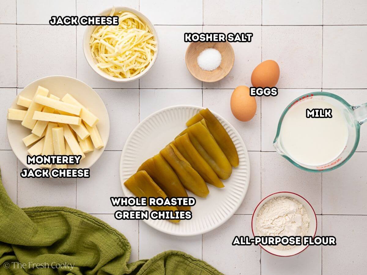 Labeled ingredients for Chile Relleno Casserole.L-R Monterey Jack cheese, shredded and sticks, kosher salt, eggs, milk, flour, green chiles.