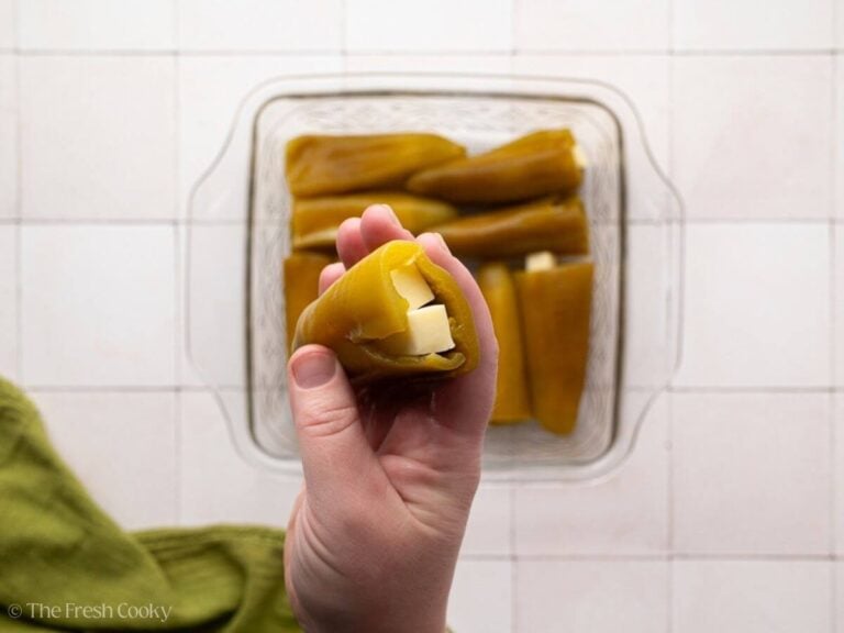 Hand holding a stuffed chili pepper.