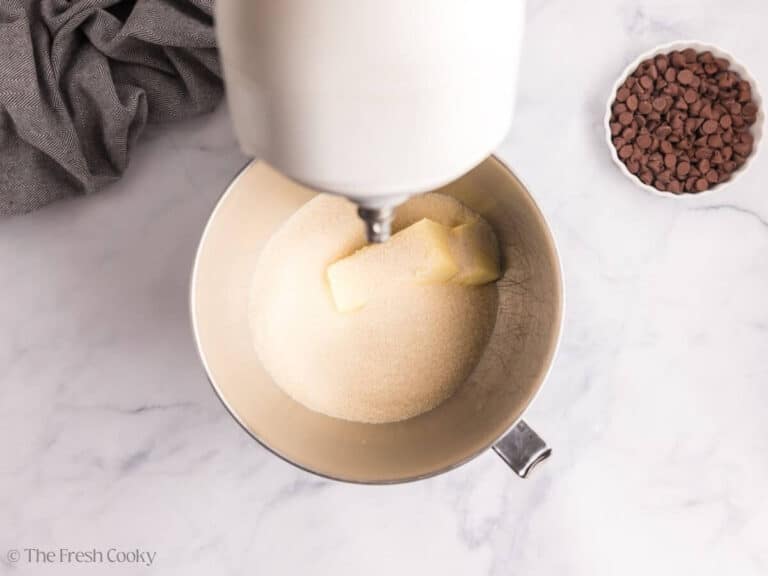 Overhead image of butter and sugar in the bowl.