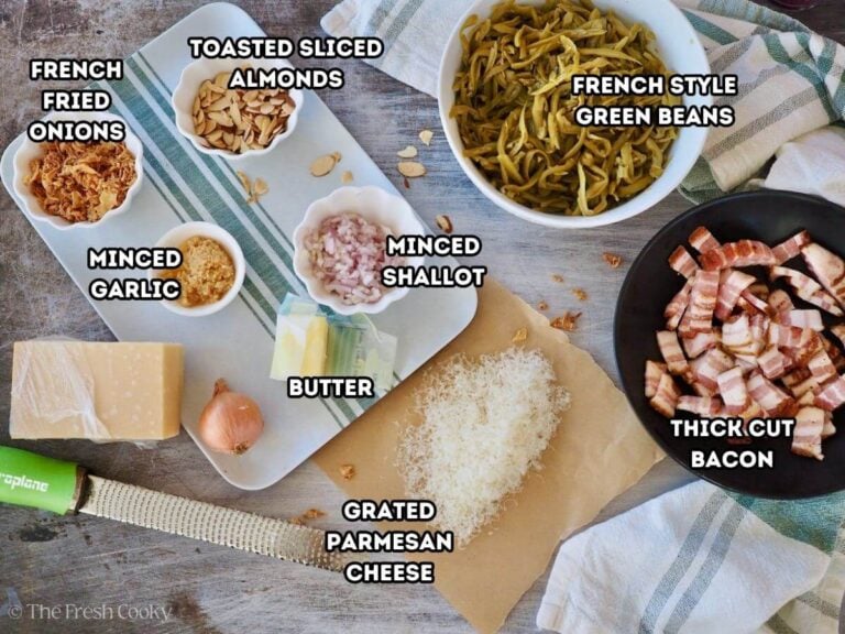 Southern green beans ingredient shot L-R fried onions, toasted almonds, canned green beans, chopped bacon, parmesan, butter, minced shallots and minced garlic.