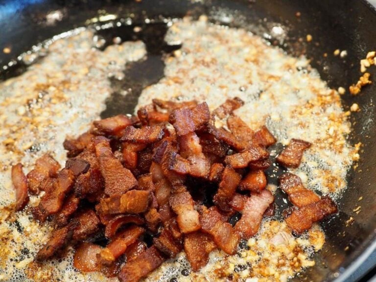 Cooked bacon added to the pan with the sauted garlic and shallots.
