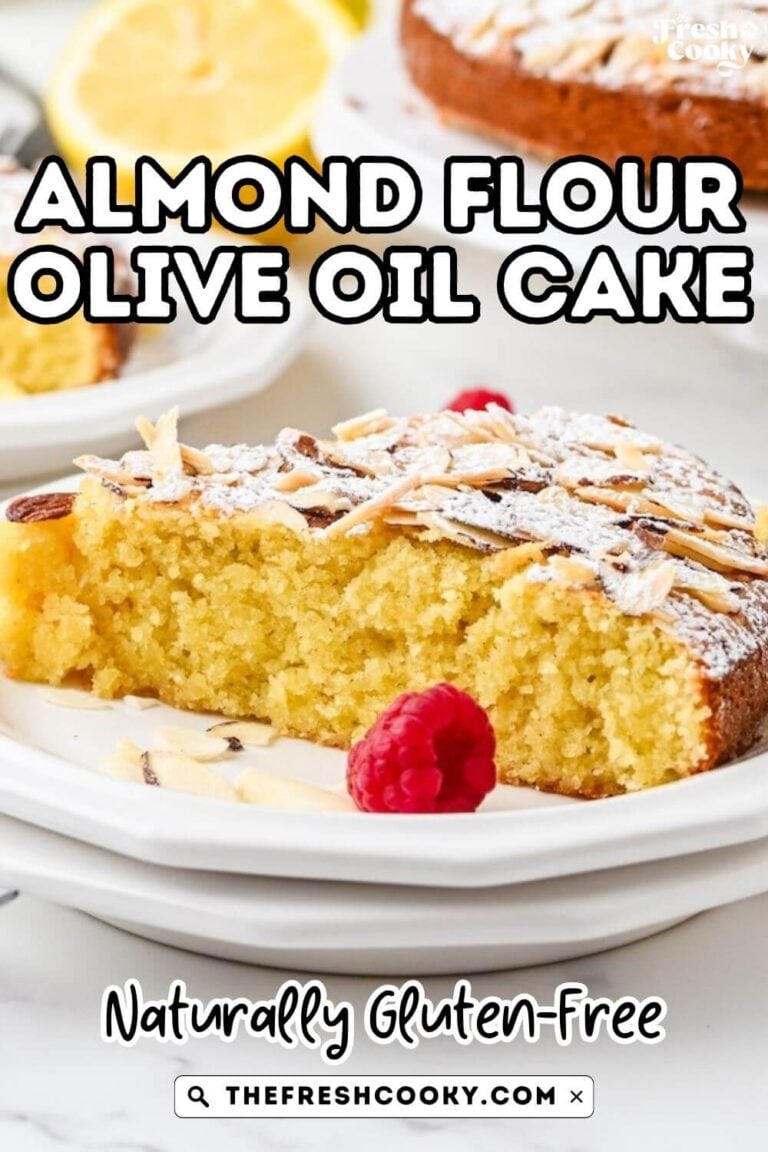Olive oil almond cake slice topped with powdered sugar and sliced almonds, to pin.