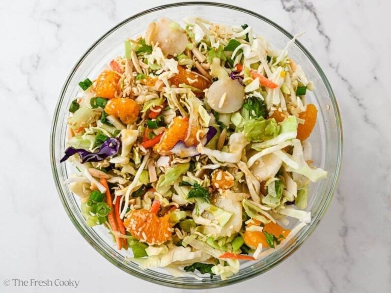 Pour on dressing and toss to coat, reserve a little for serving.