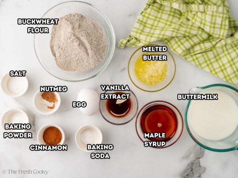 Ingredients for buckwheat pancakes. L-->R: buckwheat flour, salt, baking powder, nutmeg, cinnamon, egg, baking soda, vanilla extract, melted butter, maple syrup, and buttermilk.