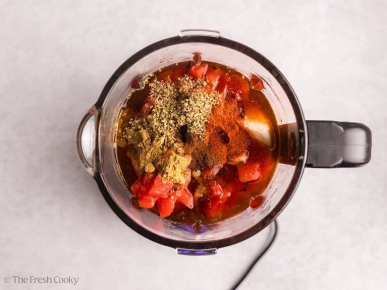 Birria sauce ingredients added to a blender.