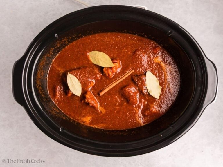 Cinnamon and bay leaves added to the crockpot.