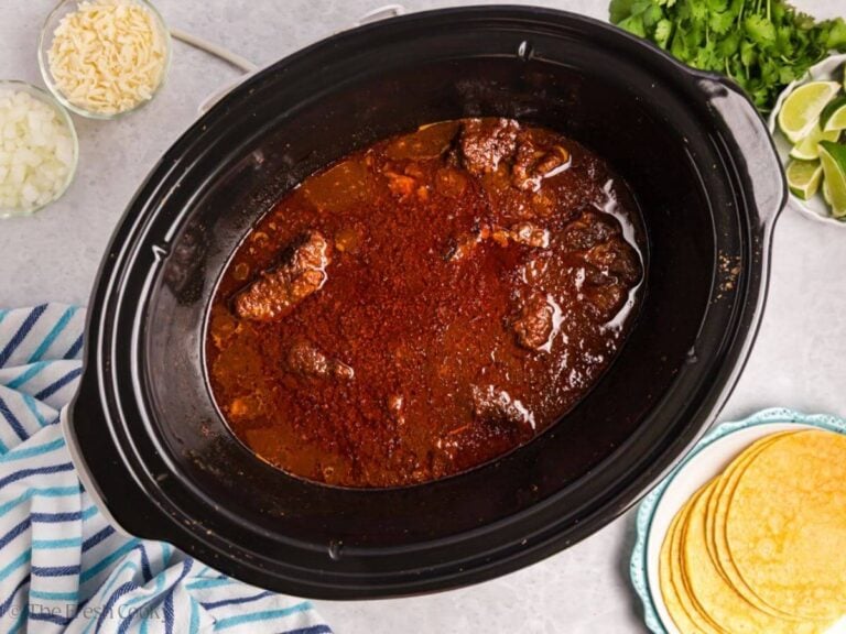 Birria beef in a crockpot after cooking before being shredded.
