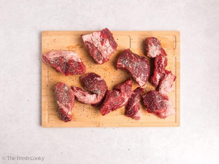 Seasoning the chuck roast on both sides.
