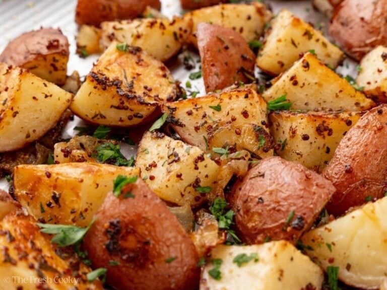 Close up image of roasted potatoes with onions.