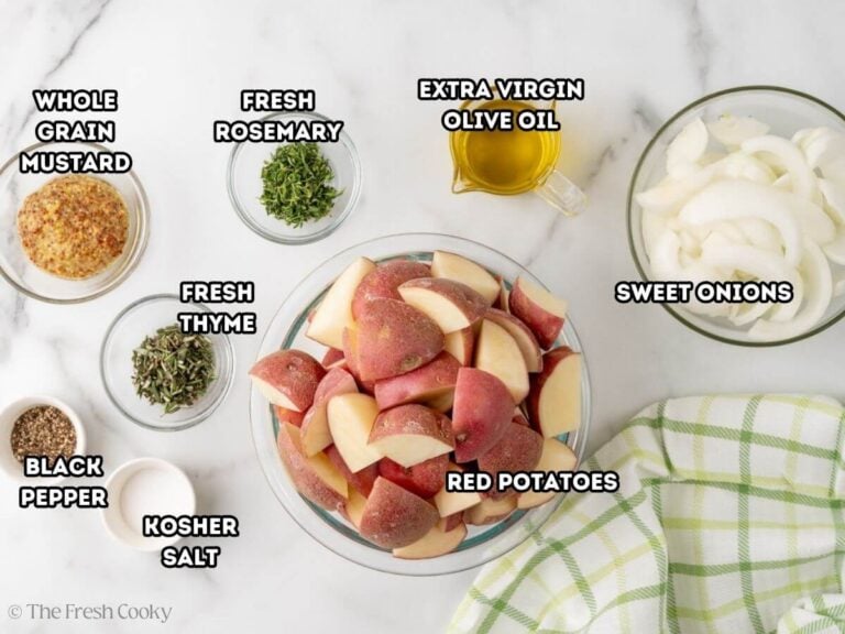 Ingredients for roasted potatoes with onions. L-->R: whole grain mustard, black pepper, rosemary, thyme, salt, olive oil, red potatoes, and sweet onions.
