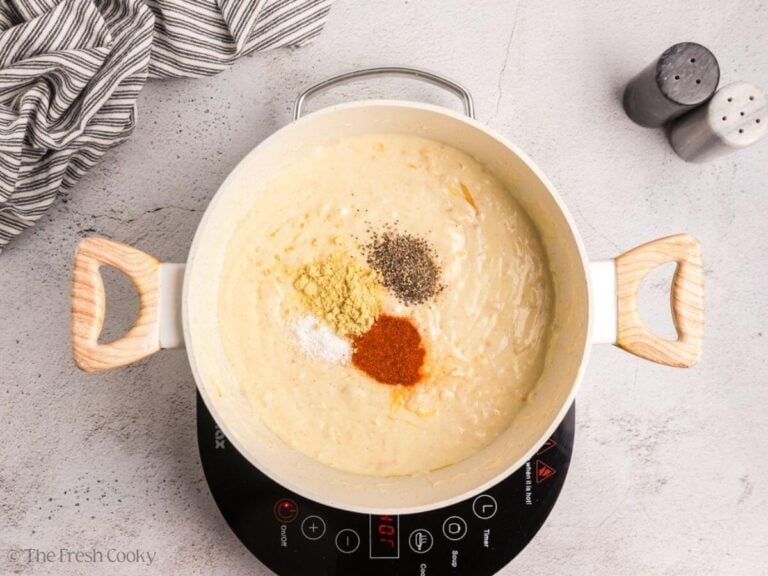 Smoked paprika, salt, pepper and dry mustard on top of cheesy mixture.