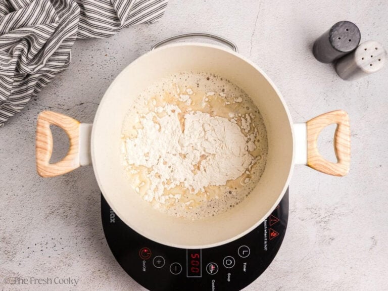 Adding flour to browned butter.
