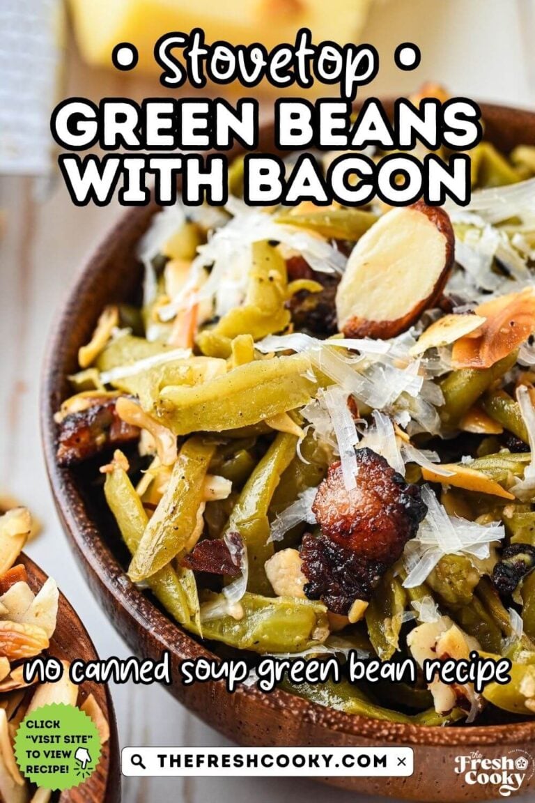 A wooden bowl filled with green beans with bacon and topped with toasted almonds and parmesan cheese, to pin.