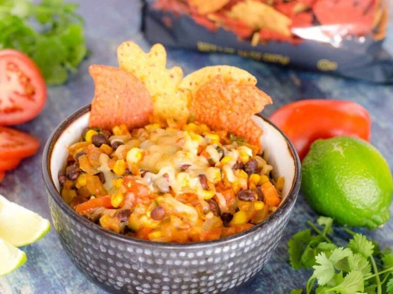 A festive bowl filled with black bean and corn salsa.
