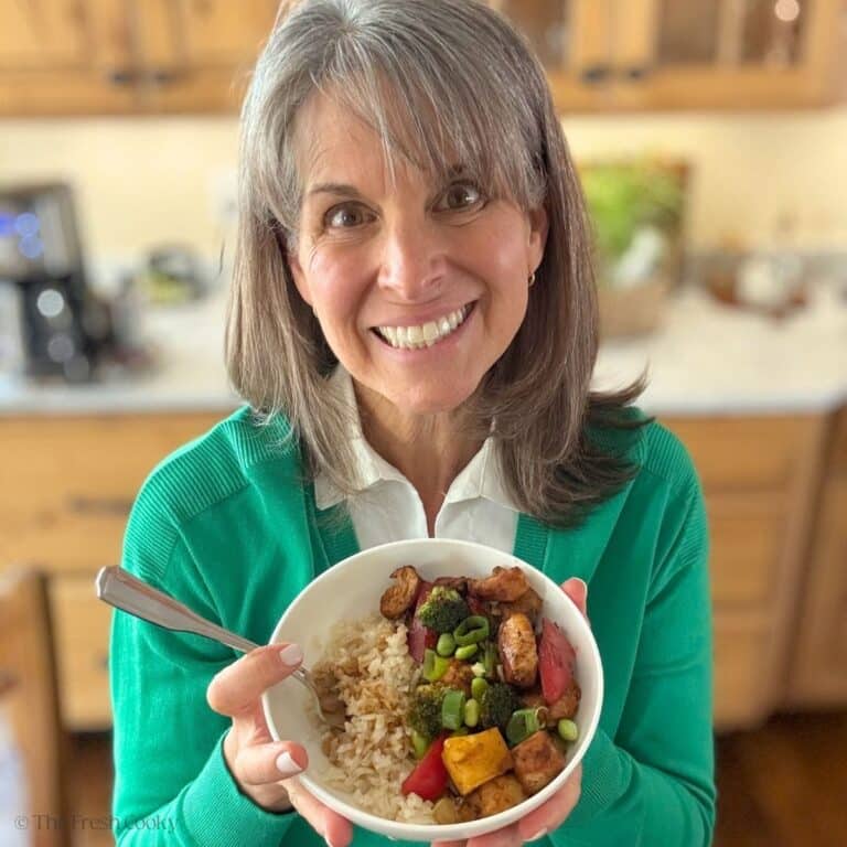 Kathleen, holding a chicken teriyaki bowl.