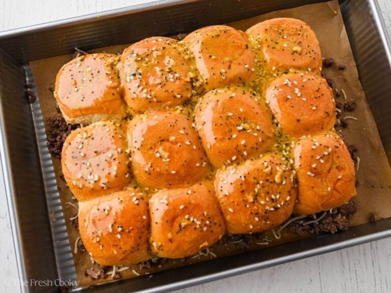 Butter sauce brushed onto slider tops and sides.