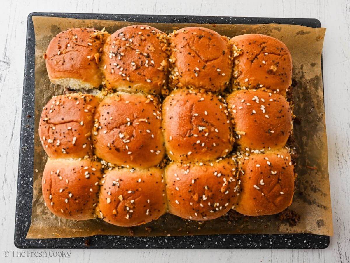 Cheeseburger sliders in a baking pan, after baking.