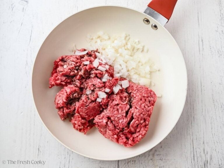 Ground beef in pan with onions.