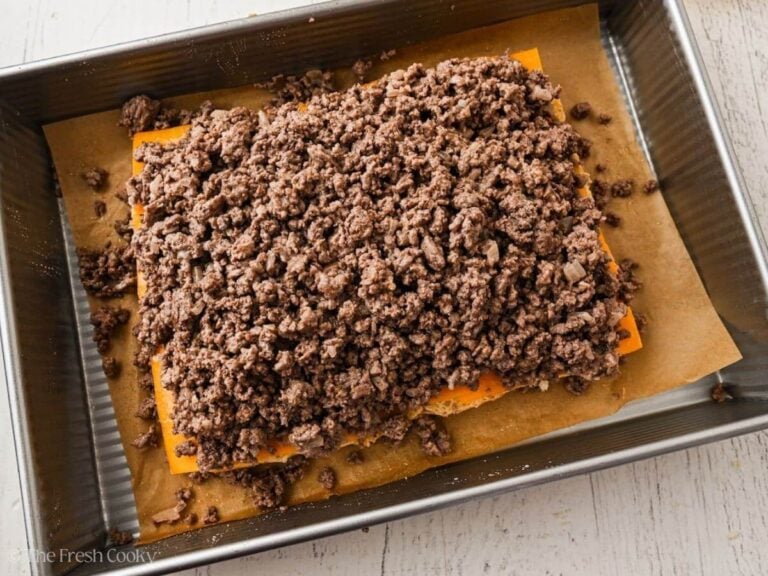 Place ground beef on top of cheese.