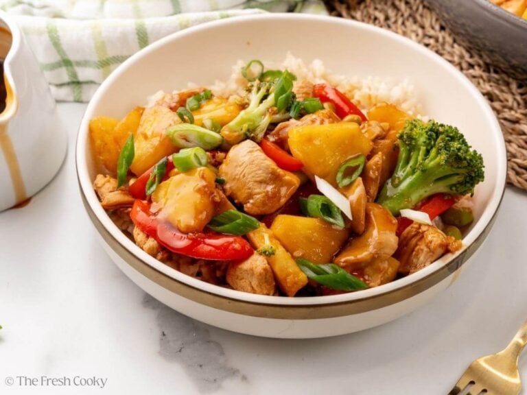 Side view of chicken teriyaki served in a bowl with rice.