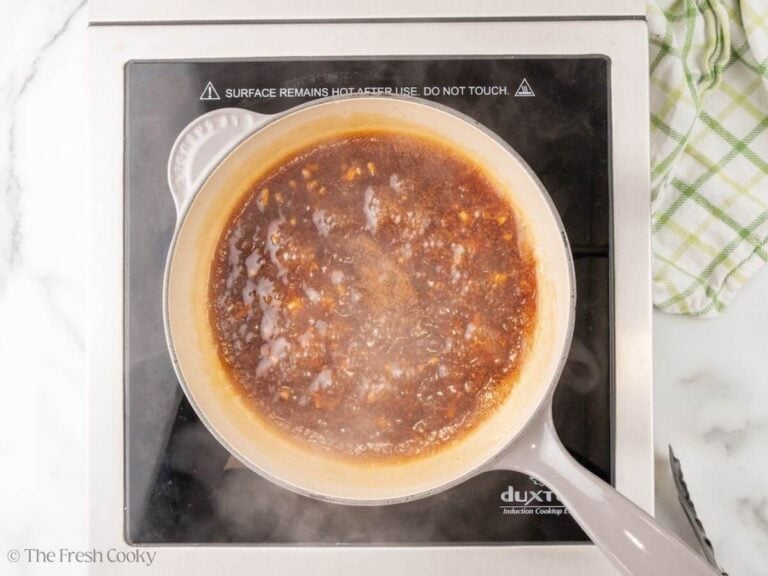 Teriyaki sauce simmering in a saucepan.