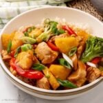 Chicken teriyaki bowl served with rice and garnished with green onions.
