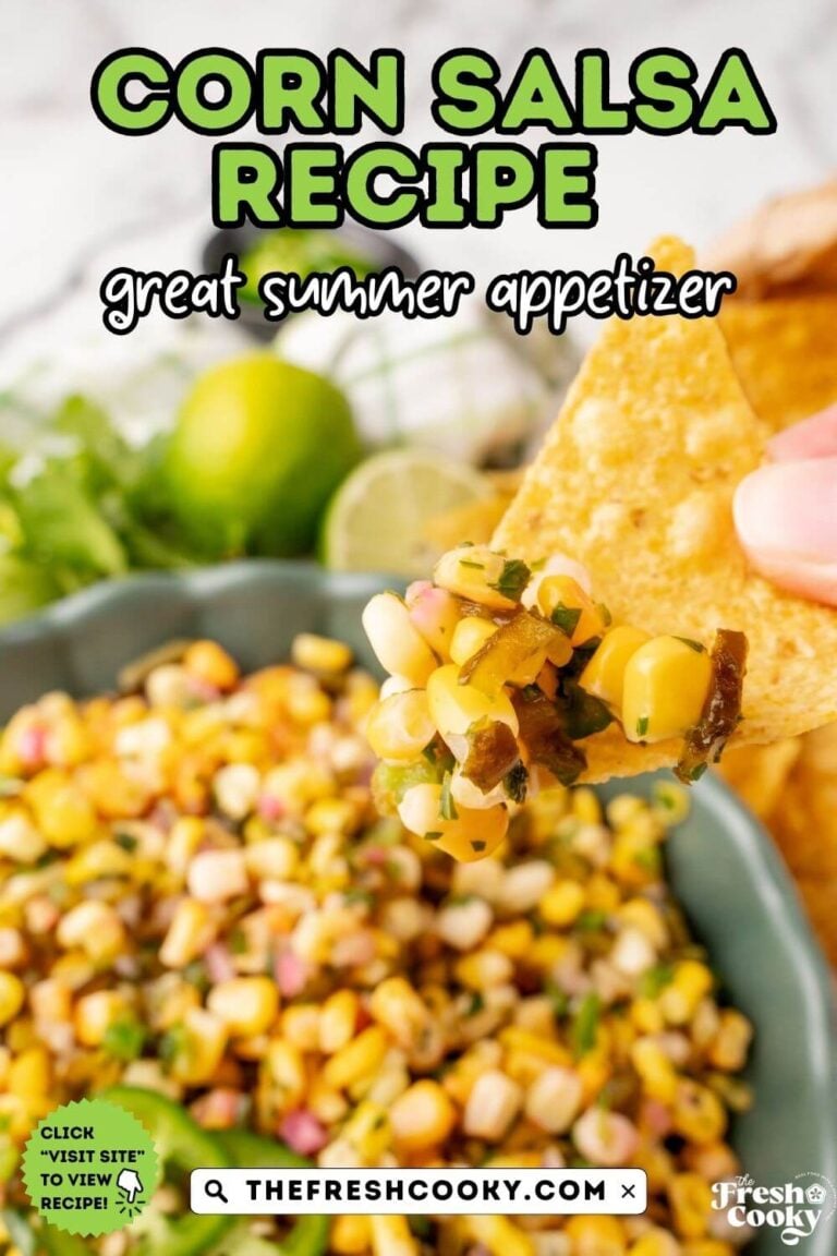 A hand scooping a large serving of Chipotle Copycat Corn Salsa onto a tortilla chip, to pin.