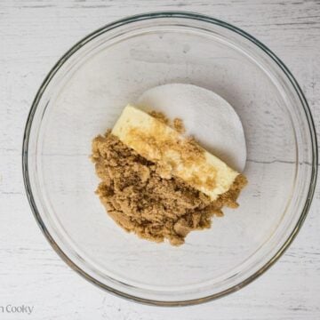 Butter and brown sugar and granulated sugar in a bowl.
