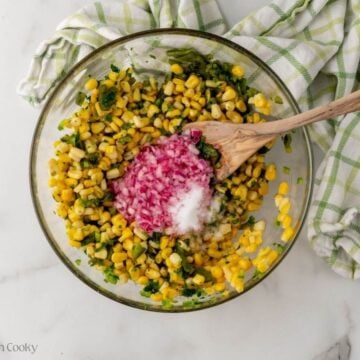 Red onion with citrus juice and salt added to the salsa.